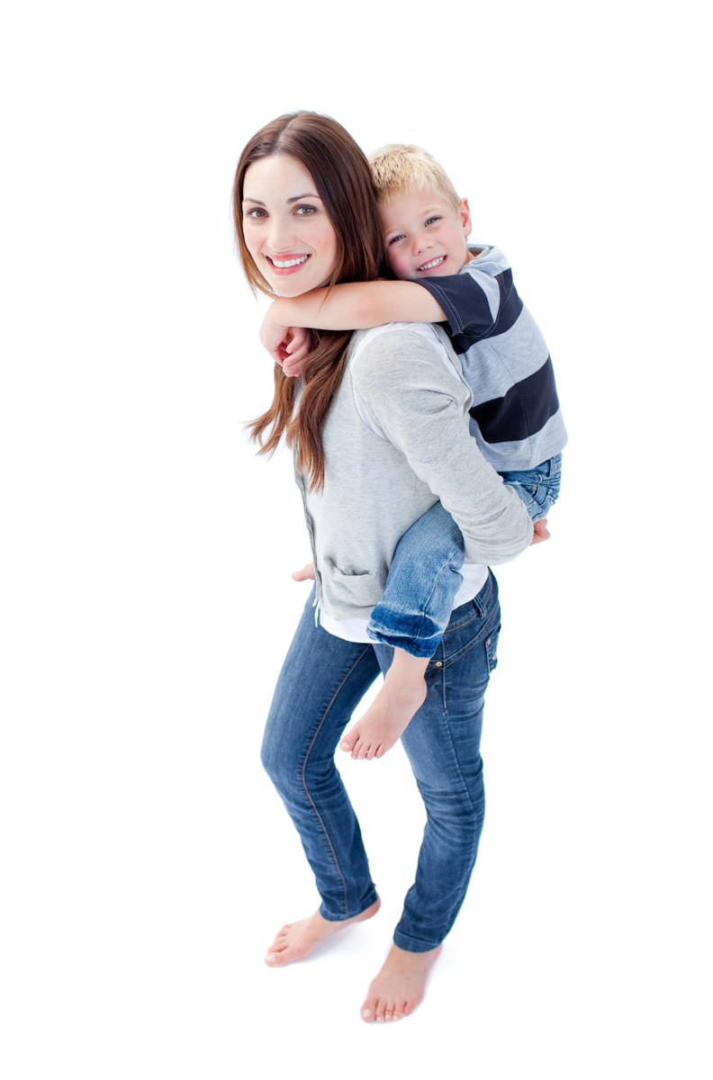 Mother carrying her child on her back