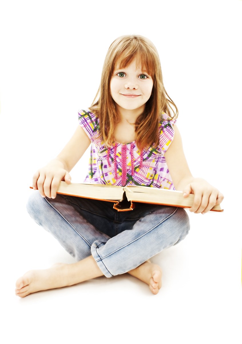 Child sitting with an open book