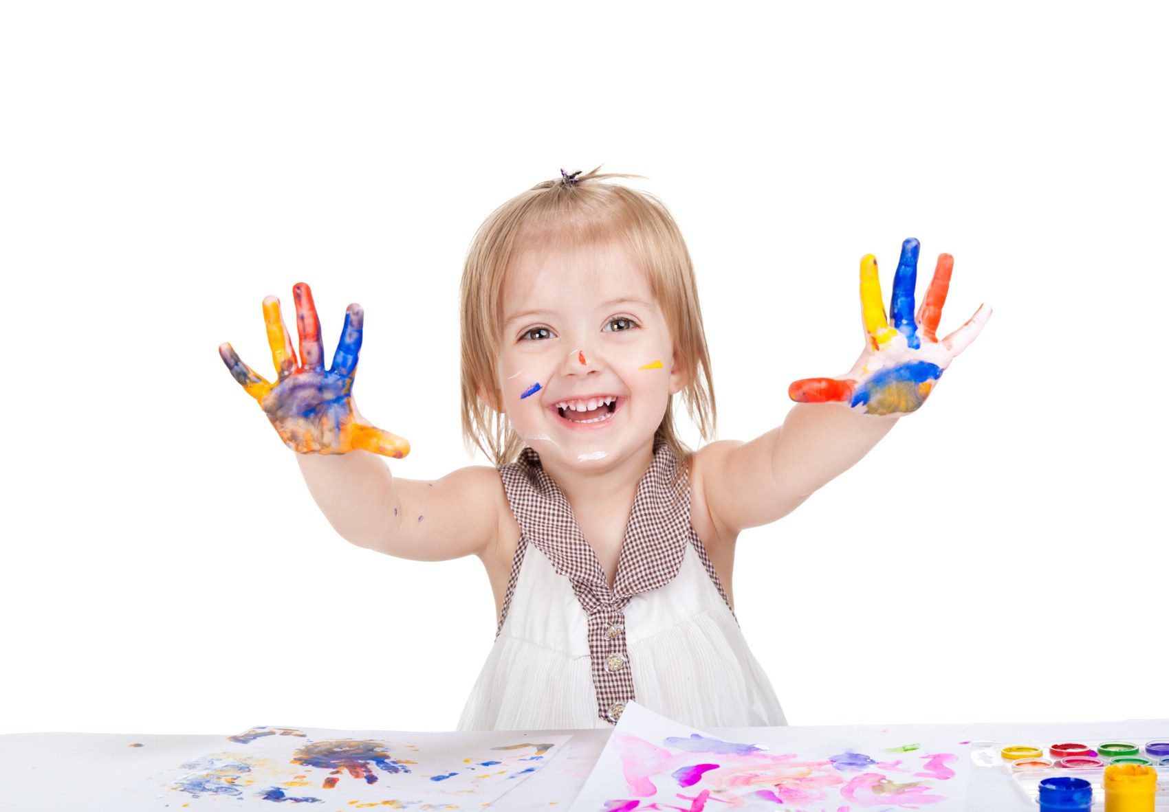 Child showing colourful painted hands